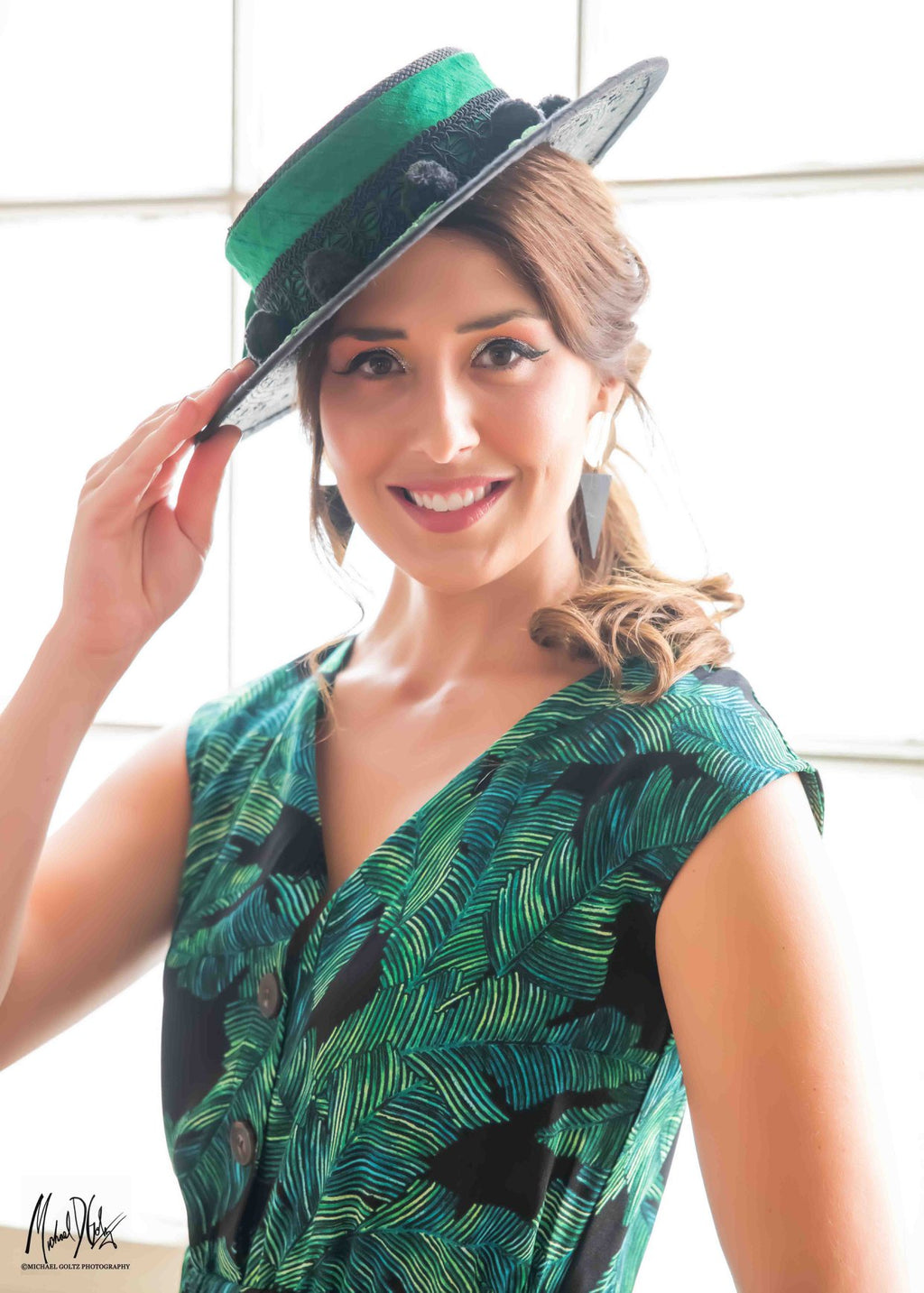 black straw boater hat for women with green accent colors