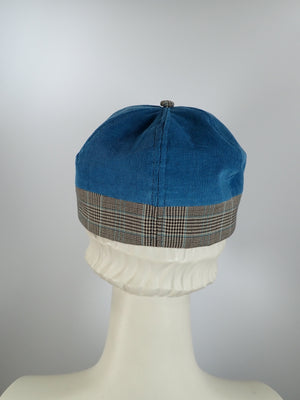 Women's fall and winter baseball style newsboy hat in teal blue and brown plaid