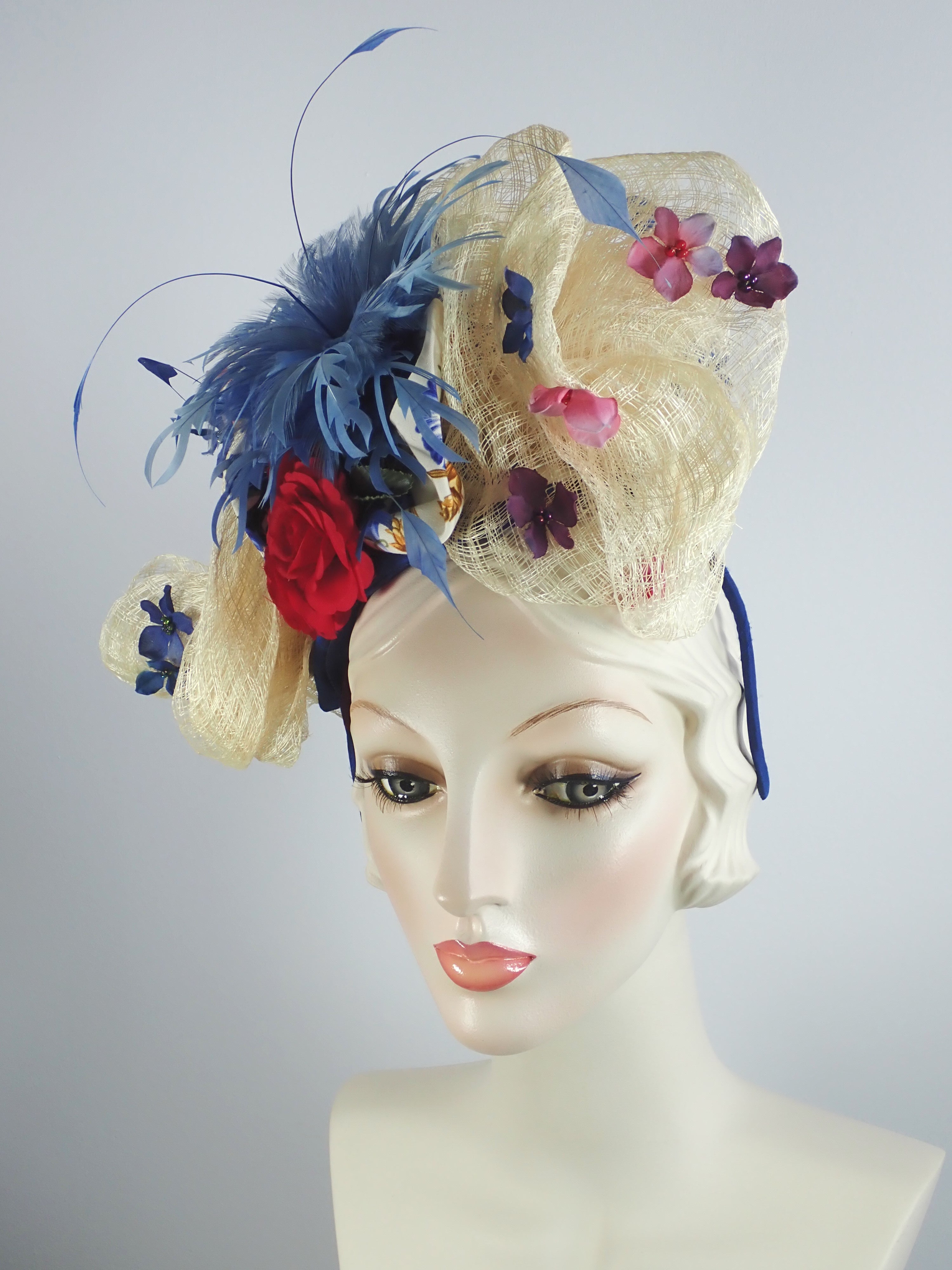 Womens Red, White, and Blue Fascinator Hat with Flowers and Blue Feathers